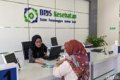 dana BPJS Kesehatan - Ilustrasi gedung BPJS Kesehatan dan layanan kesehatan nasional yang didukung suntikan dana APBN.