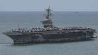 upaya bunuh diri - Kapal induk USS Abraham Lincoln saat menjalankan misi militer di kawasan strategis.