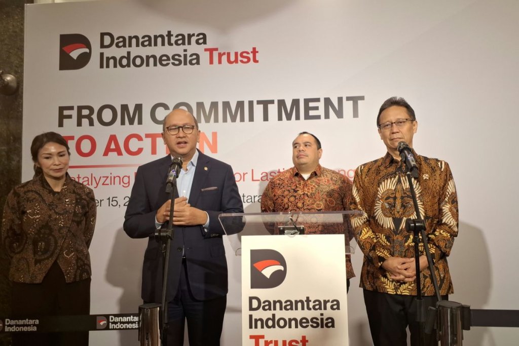dana filantropi - Ilustrasi gedung perkantoran dan logo Danantara Indonesia Trust yang fokus mengelola investasi serta dana filantropi nasional.