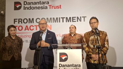dana filantropi - Ilustrasi gedung perkantoran dan logo Danantara Indonesia Trust yang fokus mengelola investasi serta dana filantropi nasional.