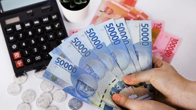 Rupiah Melemah - Ilustrasi pergerakan nilai tukar rupiah terhadap dolar AS di pasar keuangan global.