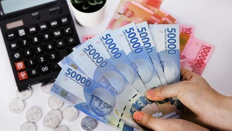 Rupiah Melemah - Ilustrasi pergerakan nilai tukar rupiah terhadap dolar AS di pasar keuangan global.